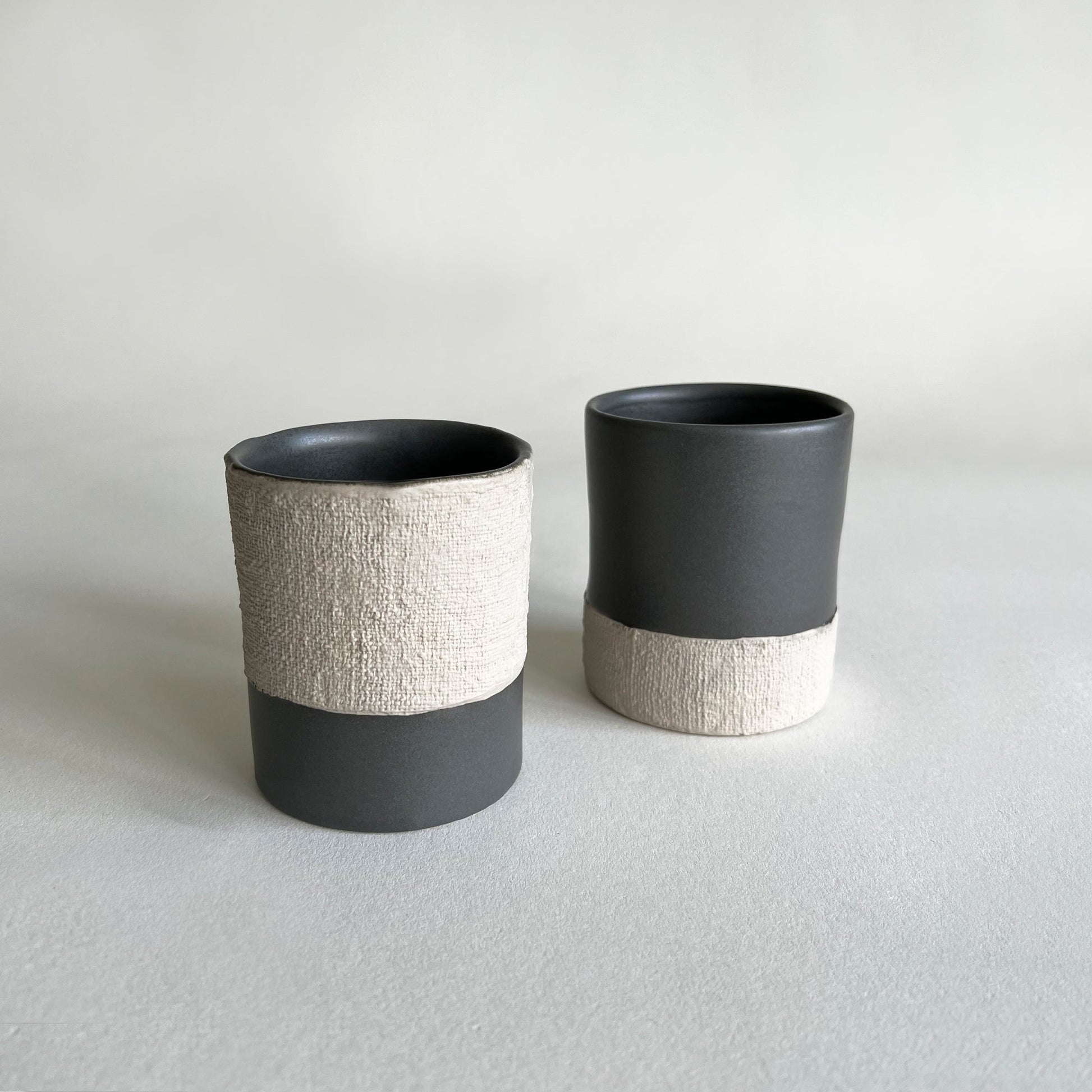 Beige black stoneware mugs set