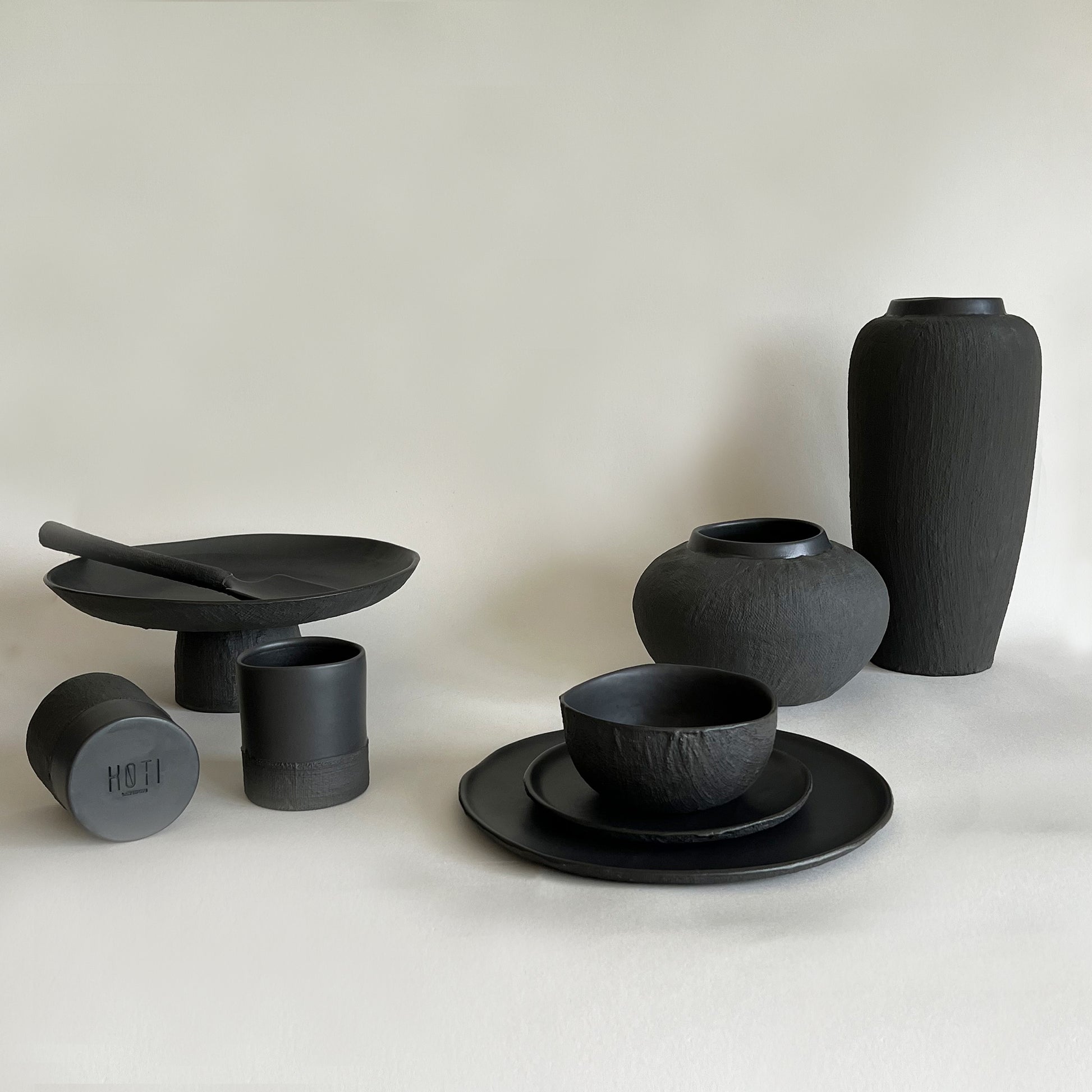 black matte ceramic set of plates bowls cups vases