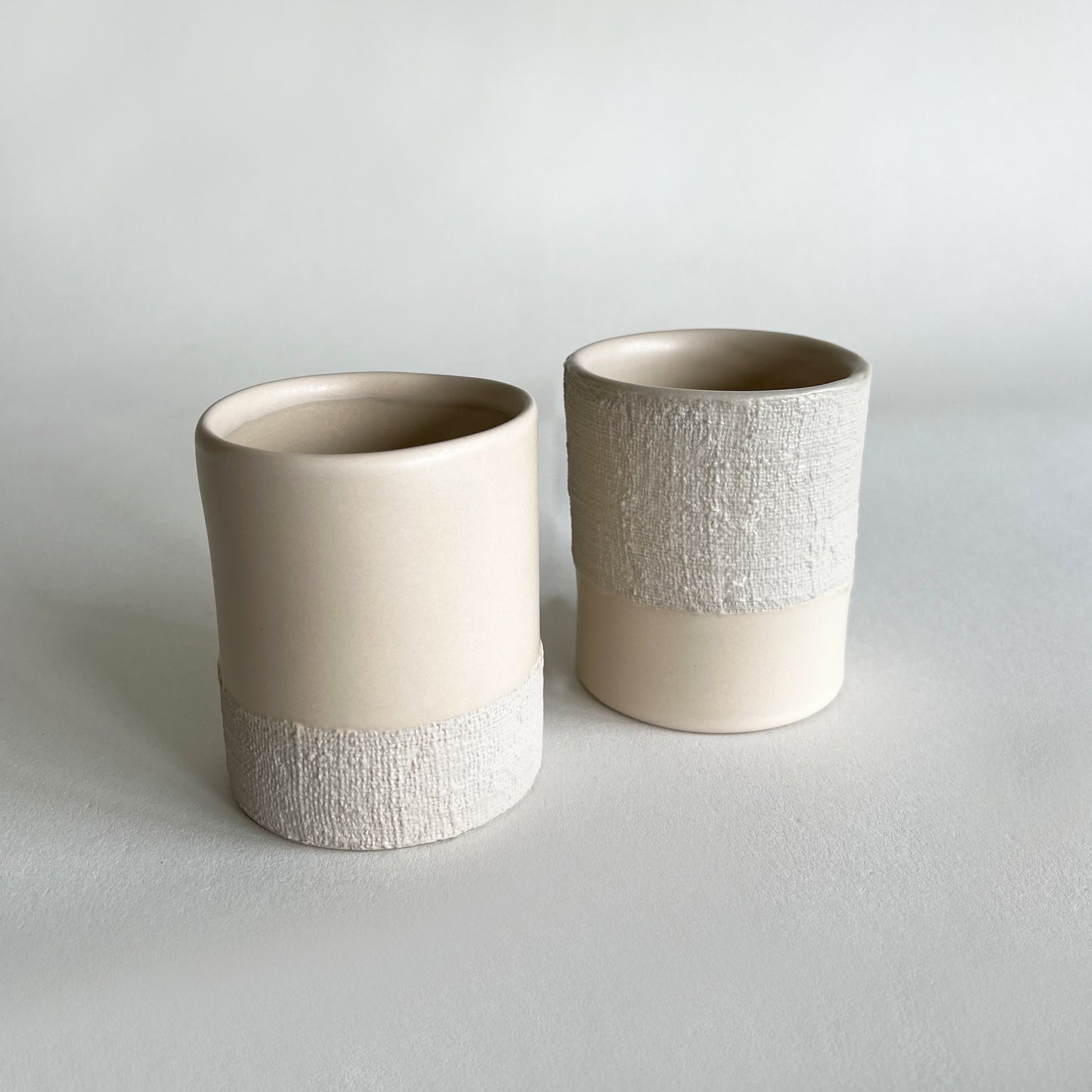 set of 2 beige ceramic cups