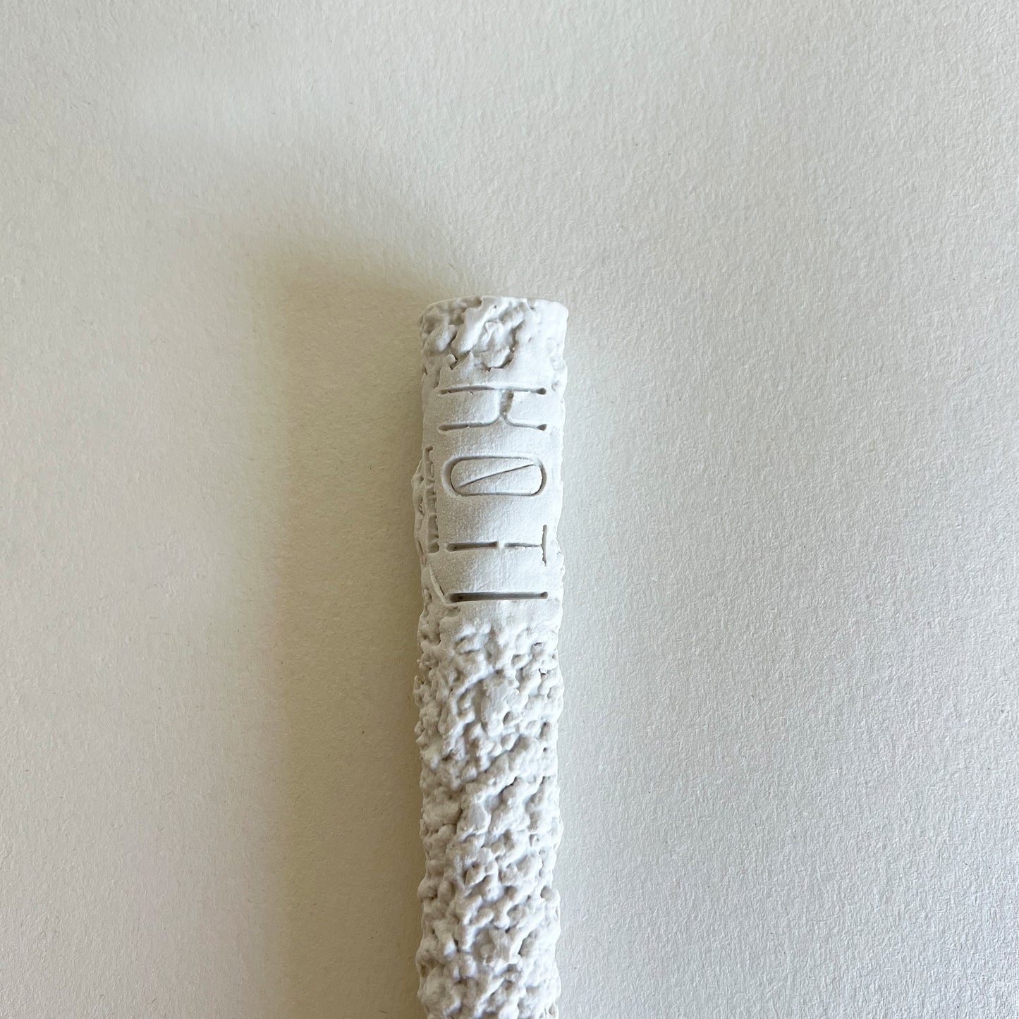 white textured ceramic spoon