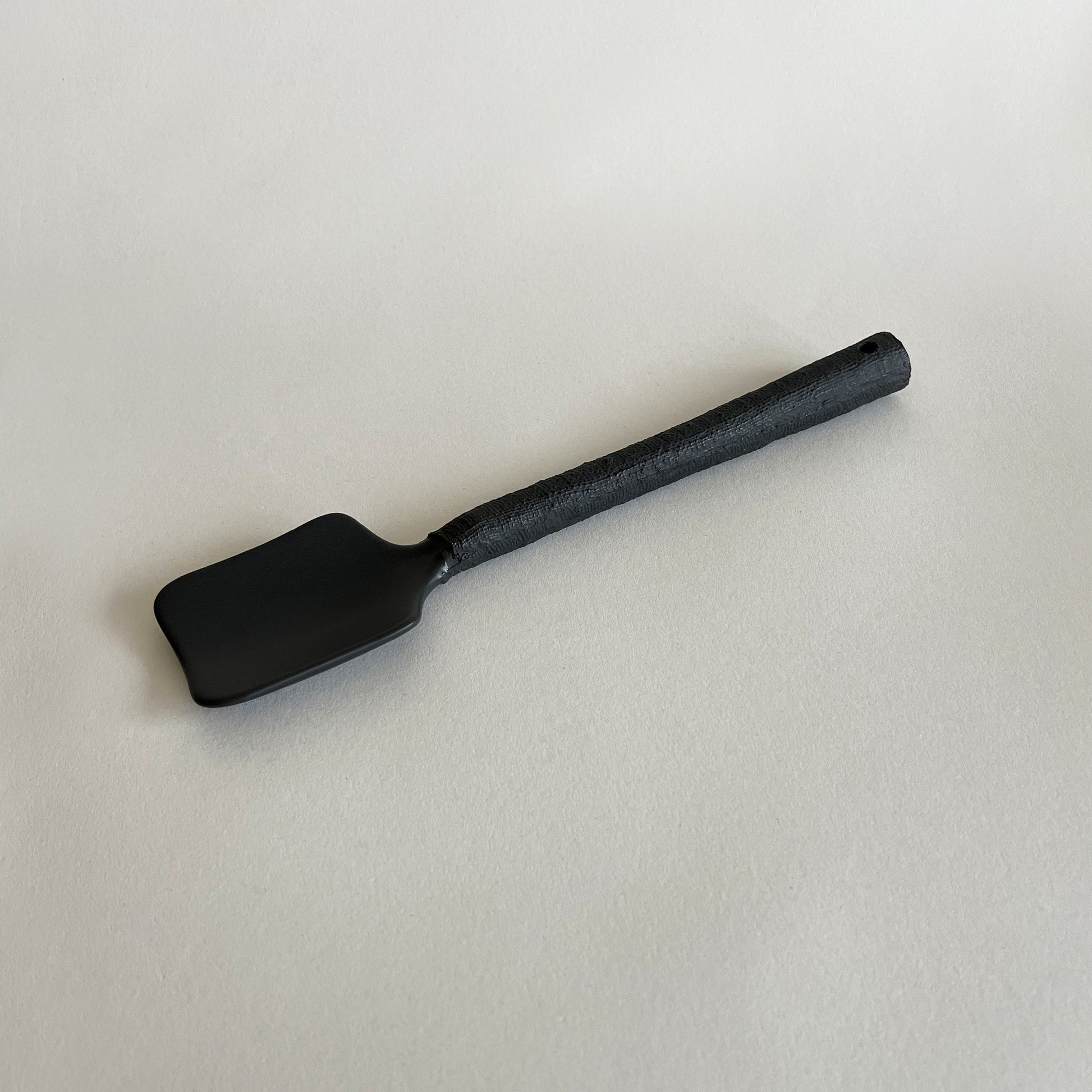 black handmade ceramic serving spoon