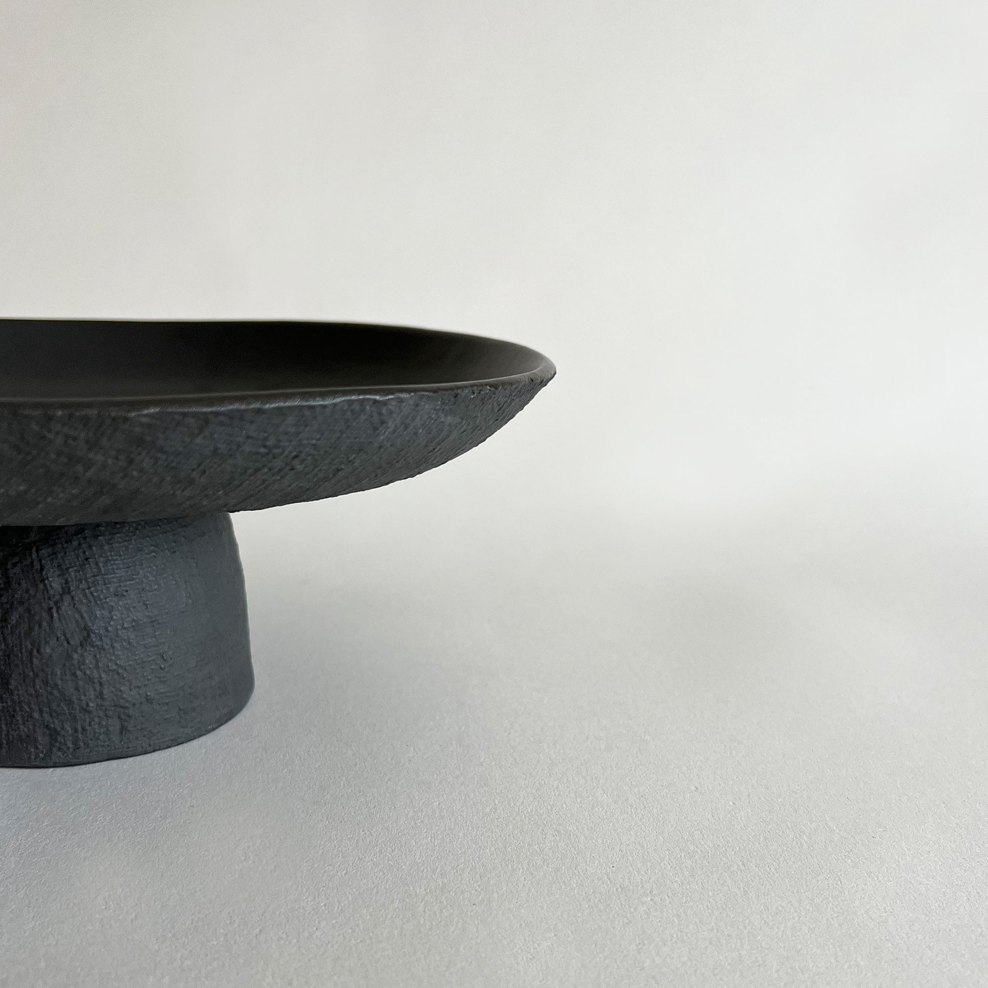 black textured ceramic cake stand